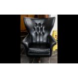 1960s G Plan Style Swivel Chair in black leatherette, rocking/tilt style.