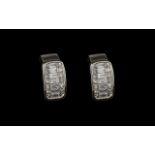 A Superb Pair of Diamond Earrings Set In