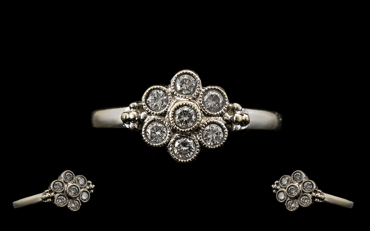 18ct White Gold Attractive Diamond Set Cluster Ring. Paver set, flowerhead design. Marked for