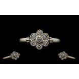 18ct White Gold Attractive Diamond Set Cluster Ring. Paver set, flowerhead design. Marked for