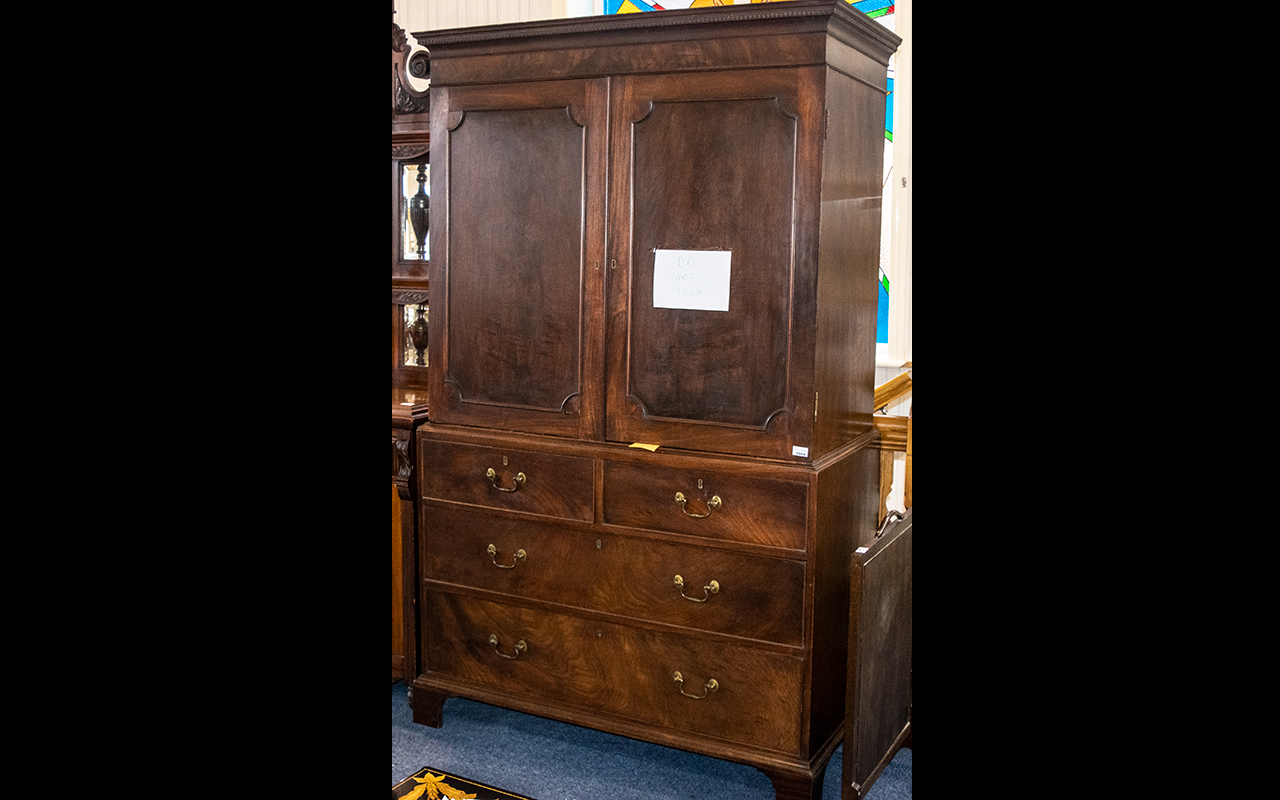 Georgian Mahogany Linen Press with a cupboard top, with sliding shelves to the interior, with a