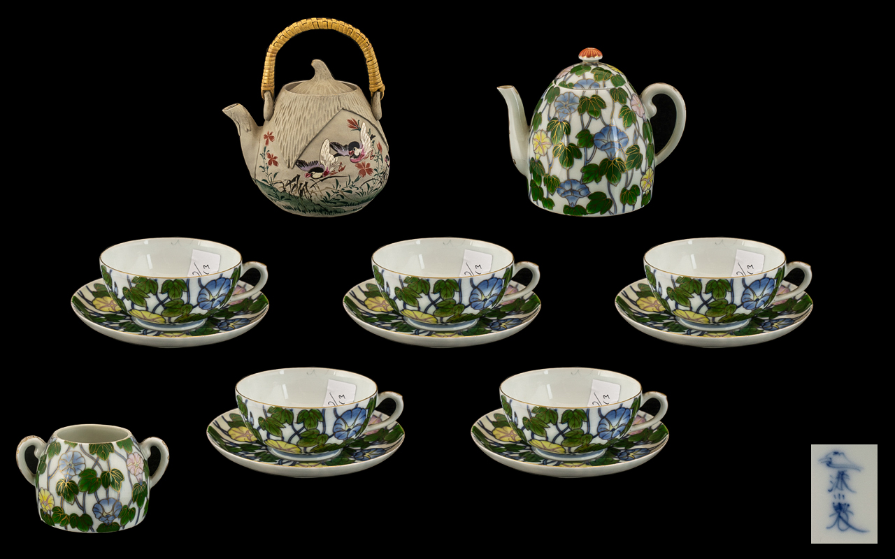 A Japanese Porcelain Tea-Set Decorated to the Body with a Floral Pattern. Meiji Period.