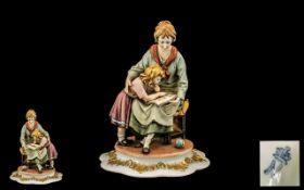 Capodimonte Porcelain Figure of a mother and child reading a book. Signed Tyche-Tosca.