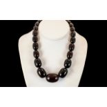1920's Dark Cherry Amber Graduated Beaded Necklace. Weight 87.5 grams. 16 Inches - 40 cm In length.
