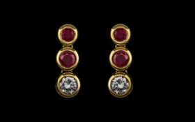 Ladies Attractive Pair of Ruby and Diamond Drop Earrings Set In 18ct Gold.