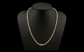 Antique Period - Nice Quality Seed Pearl Necklace. Features a 9ct Gold and Enamel Clasp. Marked 9ct.