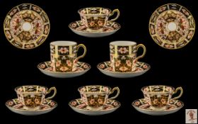 A Set of Royal Crown Derby Cigar Pattern Cups and Saucers.