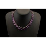 Victorian Amethyst Rivière Necklace Set With A Series Of Graduated Oval Faceted Cut Amethysts,