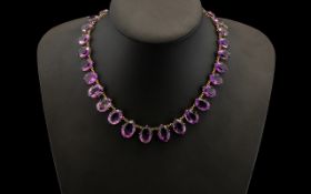 Victorian Amethyst Rivière Necklace Set With A Series Of Graduated Oval Faceted Cut Amethysts,