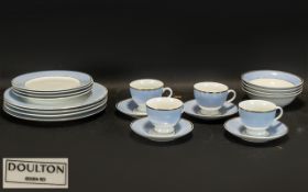 A Modern Four Setting Doulton Dinner Service. White and Pale blue border. Comprises dinner plates,