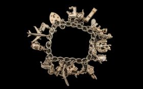 A Vintage Silver Charm Bracelet, Loaded with 21 Solid Silver Charms.