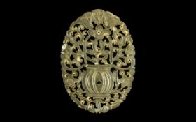 Chinese Antique Carved Jade Oval Piece fine detailing with fret work apertures, depicting an urn