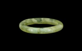 Chinese Green Jadeite Bangle with mutton fat inclusions, 3.5'' diameter