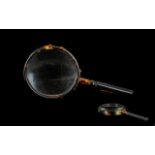 1930s Faux Tortoiseshell Lucite Desk Magnifying Glass with gilt metal mount. 3'' diameter, 6.5''