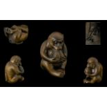 Oriental Carved Boxwood Netsuke, Depicts a Seated Figure of a Monkey Eating a Large Nut.