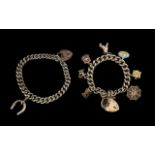 A Silver Curb Bracelet Loaded with Seven ( 7 ) Silver Charms, Features Archer, Spiders Web, Bible,