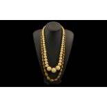 Antique Graduated Ivory Bead Necklace Length 25 Inches, Beads Ranging In Size From 27mm To 9mm,