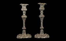 Pair of Silver Plate Roccocco Style Candlesticks. Measuring 9.5 Inches In Height. Please See Image.