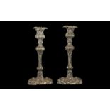 Pair of Silver Plate Roccocco Style Candlesticks. Measuring 9.5 Inches In Height. Please See Image.