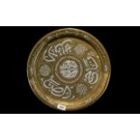 Antique Middle Eastern Brass Charger onlaid in silver with Arabic script. Measures 16 inches in