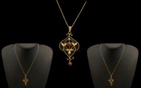 Edwardian Period Attractive 1902 - 1910 9ct Gold Ornate Open Worked Pendant Set with Garnets,