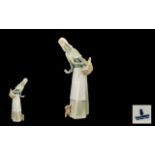 Lladro - Porcelain Figure ' Girl with Basket ' Model No 1034. Issued 1969 - 1991. Height 12 Inches.