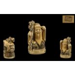 Japanese Early 20th Century Carved Ivory Netsuke of a Wiseman / Sage with Staff signed to underside,