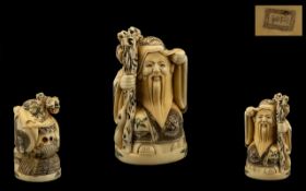 Japanese Early 20th Century Carved Ivory Netsuke of a Wiseman / Sage with Staff signed to underside,