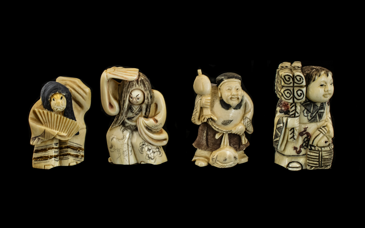 A Collection of Four Japanese Carved Ivory Netsukes comprising of two dancing girls with fans, a