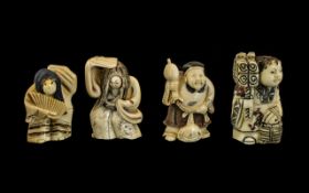 A Collection of Four Japanese Carved Ivory Netsukes comprising of two dancing girls with fans, a