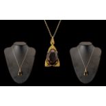 9ct Large Smokey Topaz Pendant on a 9ct Gold Chain Large Stone 2 cm In length.