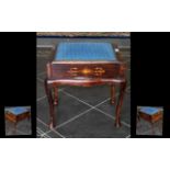 An Edwardian Inlaid Piano Stool with a lift up blue cushioned seat. Raised on cabriole legs.