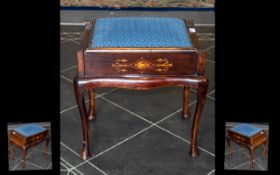 An Edwardian Inlaid Piano Stool with a lift up blue cushioned seat. Raised on cabriole legs.