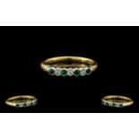 18ct Gold - Attractive Seven Stone Emerald and Diamond Ring. Full Hallmark for 750 - 18 ct.
