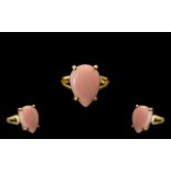 Pink Opal Pear Cut Solitaire Ring, a 7ct cabochon cut pink opal, probably mined in Peru,