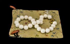 A White Nephrite Jade Beaded Necklace Beautiful set of orange jade nephrite beads from western