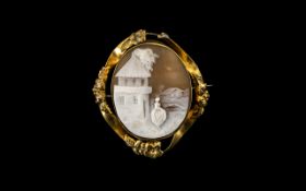 Victorian Oval Cameo Brooch, Depicting a Lady In a Village Street, In a Gilt Metal Frame.