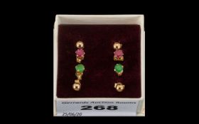 Collection Of Four 9ct Gold Stud Earrings one set with emeralds and one set with rubies and two