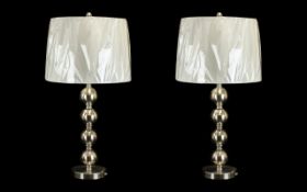 Pair of Contemporary Silvered Metal Lamps with Baubles Column Designed with Modern White Shades.