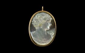 Italian Nice Quality Mother of Pearl Cameo Brooch set in a 9ct gold oval shaped mount. Marked 9ct.