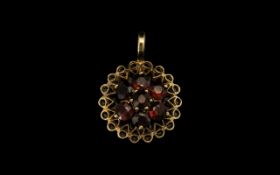 9ct Gold Garnet Pendant fully hallmarked, pendant with flower head setting of garnet set stones.