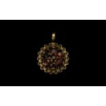 9ct Gold Garnet Pendant fully hallmarked, pendant with flower head setting of garnet set stones.