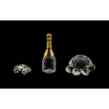 3 Small Unboxed Swarovski Items. Includes 1/ Champagne Bottle, 4.5 cm High. 2/ Tortoise 3.