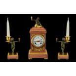 French Clock Garniture. A pink marble and ormolu mounted clock garniture.