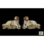 Pair of Victorian Bisque Reclining Newfoundland Dogs, hand painted,