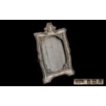 Silver Photo Frame fully hallmarked for Birmingham 1909. 8" tall, a/f condition.