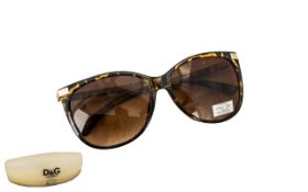 Dolce & Gabbana Pairof Sunglasses by Oscar de la Renta. 100% UV protection, with case.