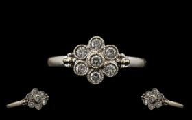 18ct White Gold Attractive Diamond Set Cluster Ring. Paver set, flowerhead design.