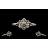 18ct White Gold Attractive Diamond Set Cluster Ring. Paver set, flowerhead design.