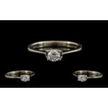 White Gold Single Stone Diamond Ring set with a round modern cut, estimated diamond weight .